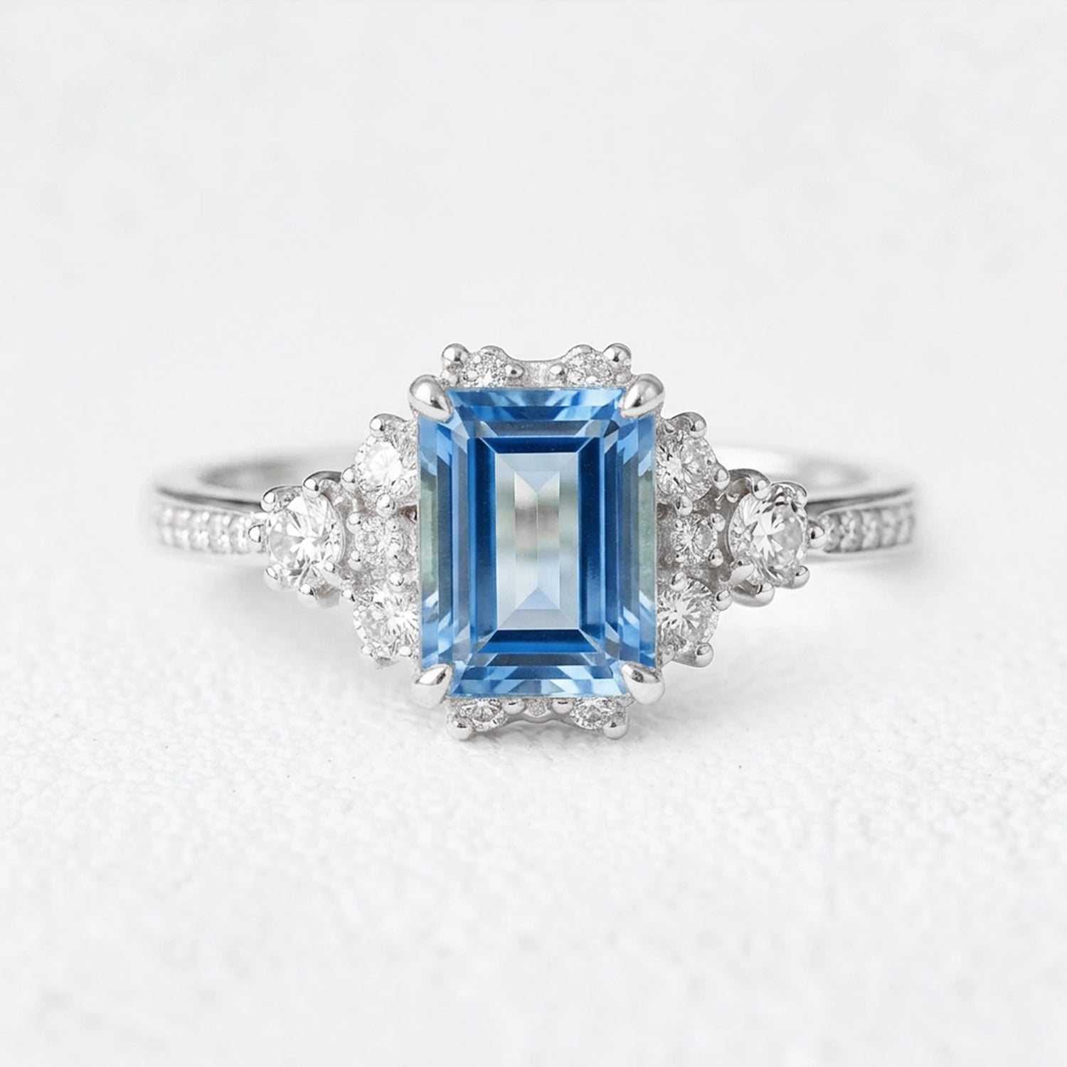 Rosalind‘s Coronet | Emerald Cut Sapphire Halo Engagement Ring