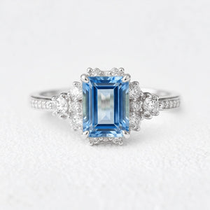 Rosalind‘s Coronet | Emerald Cut Sapphire Halo Engagement Ring