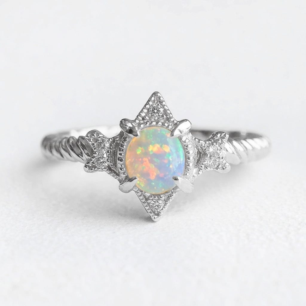 Aurora’s Lattice | Oval Opal Engagement Ring with Lozenge Weave Setting.