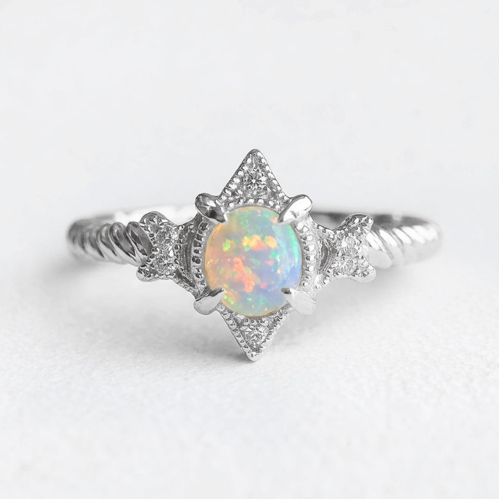 Aurora’s Lattice | Oval Opal Engagement Ring with Lozenge Weave Setting.