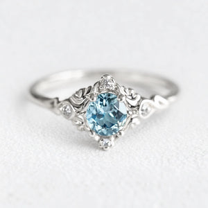 Marina’s Lace | Round Aquamarine Engagement Ring with Filigree Setting.