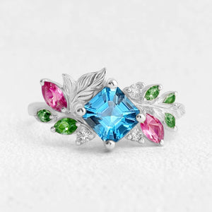 Aurora’s Leafwhisper | Swiss Blue Asscher Cut Topaz Nature Inspired Leafy Engagement Ring.