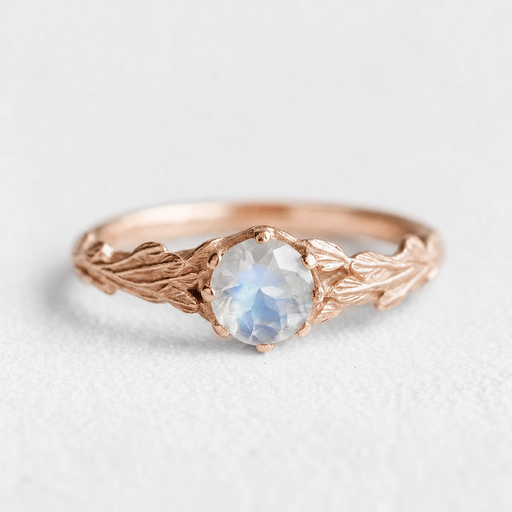 Athena’s Wings | Round Moonstone Olive Branch Engagement Ring.