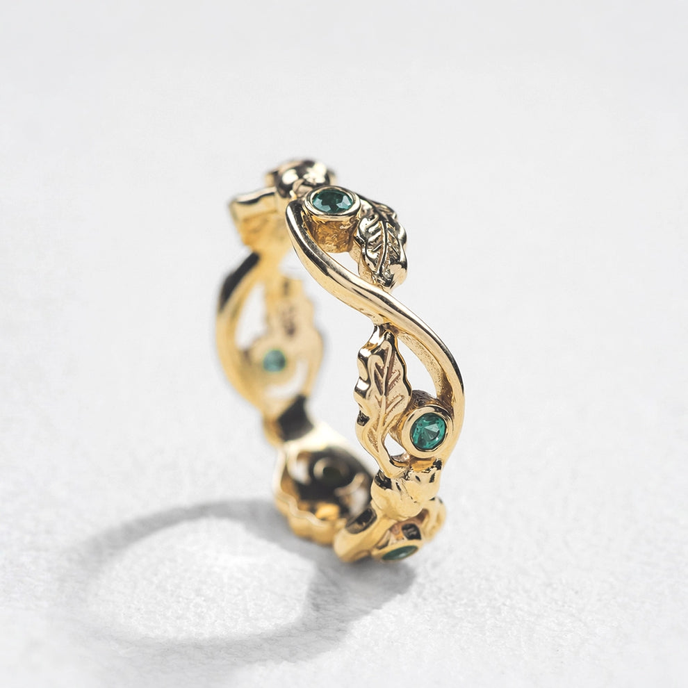 The Lacy Oak | Openwork Oak Leaves & Natural Emerald Women's Wedding Band.
