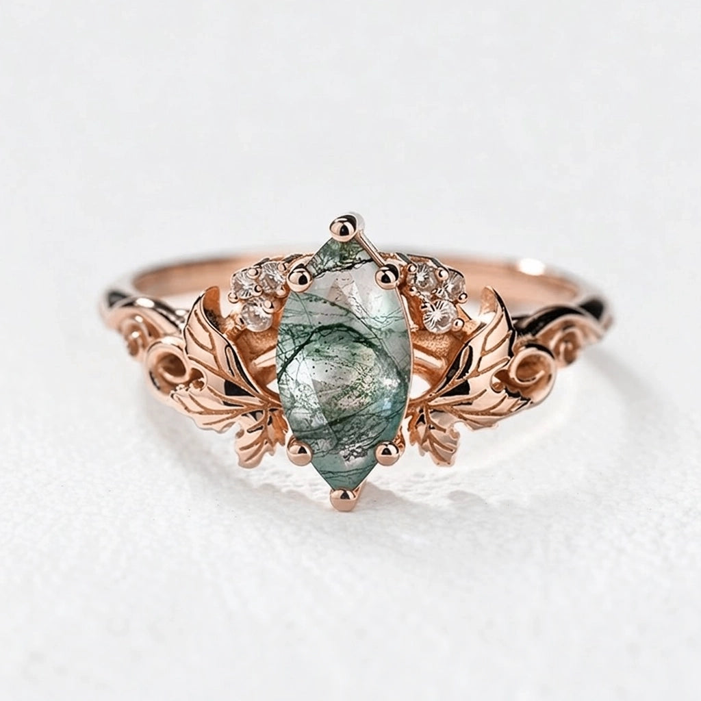 Flora’s Laurel | Marquise Cut Moss Agate Engagement Ring with Diamond Leaves.