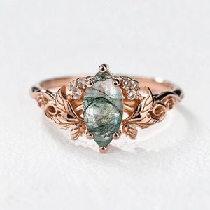 Flora’s Laurel | Marquise Cut Moss Agate Engagement Ring with Diamond Leaves.
