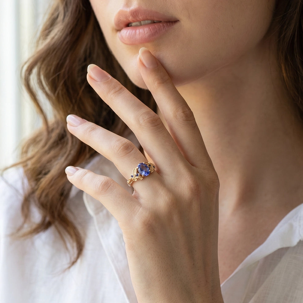 Aria‘s Glade | Oval Cut Tanzanite & Blue Diamond Leaf Engagement Ring.