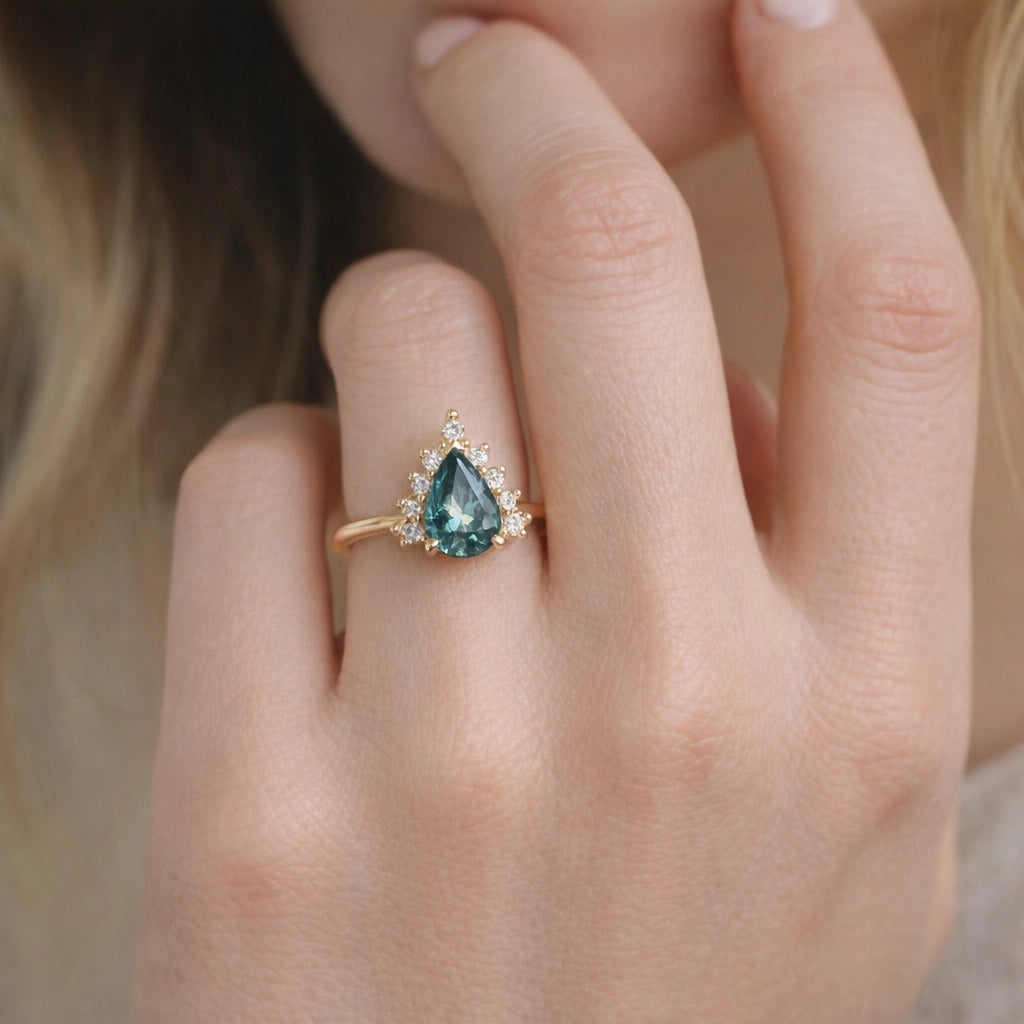Mermaid’s Crown | Pear Teal Sapphire Halo Engagement Ring.