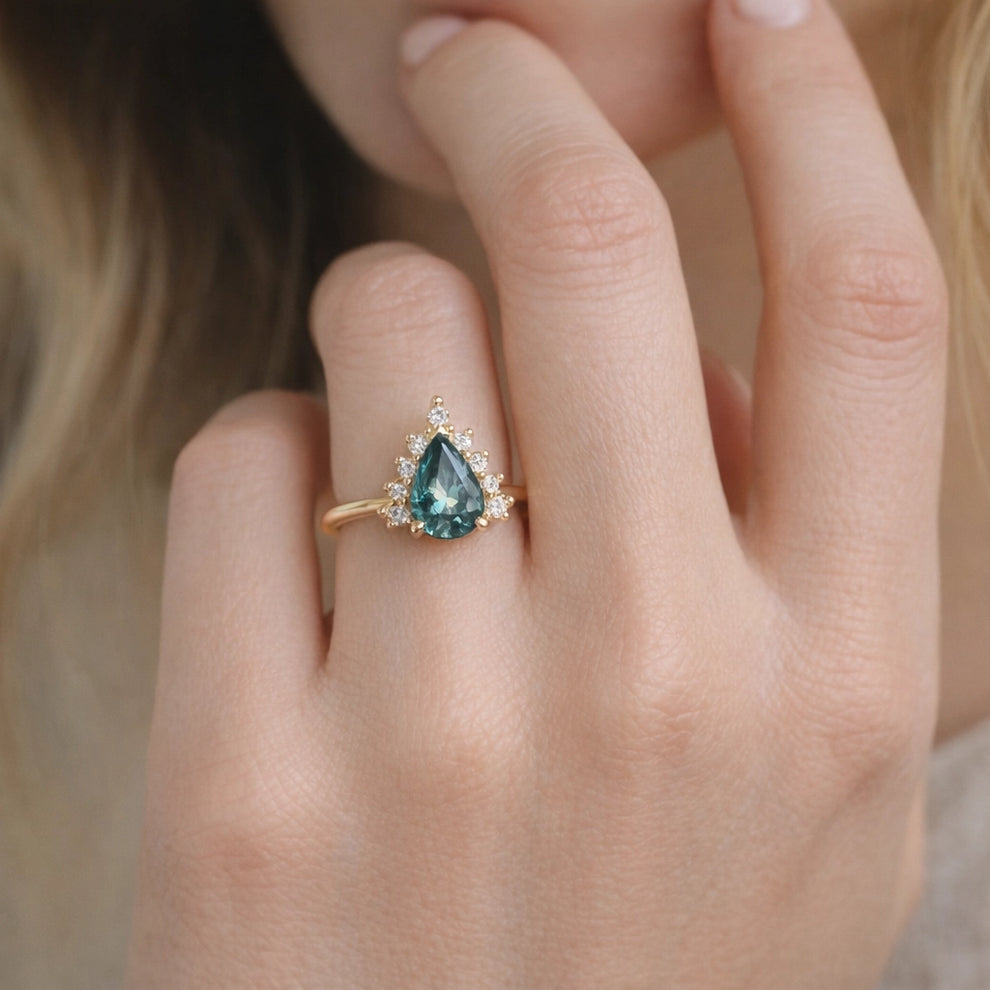 Mermaid’s Crown | Pear Teal Sapphire Halo Engagement Ring.