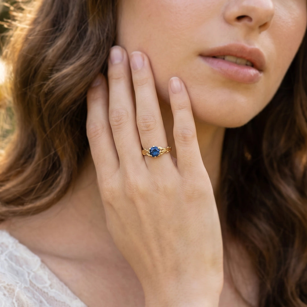 Athena’s Wisdom | Round Blue Sapphire Olive Branch Engagement Ring