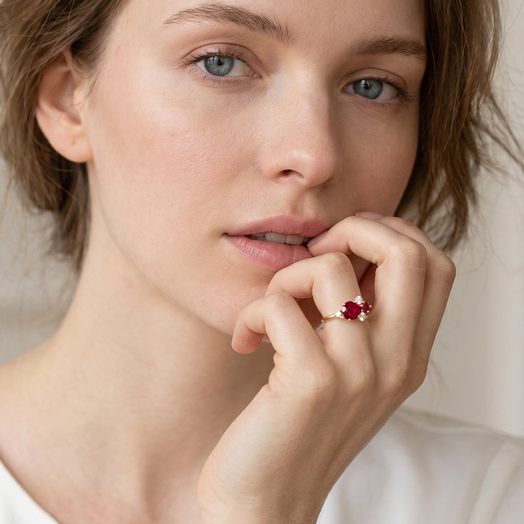 Rosalind’s Rose | Round Ruby Engagement Ring with Drifting Diamond Petal Halo.