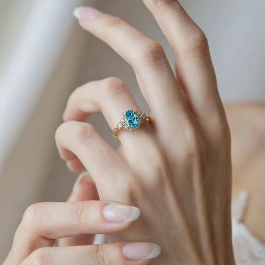 Aria‘s Bay | Oval Cut Blue Topaz Halo Engagement Ring
