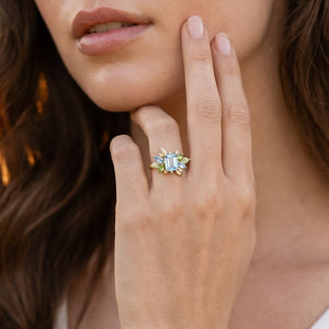 Flora’s Spring | Emerald Cut Blue Aquamarine Leaf Halo Engagement Ring.