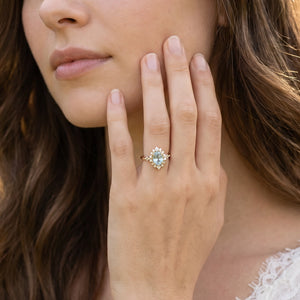 Theia’s Tide | Oval Pink Aquamarine Halo Engagement Ring.