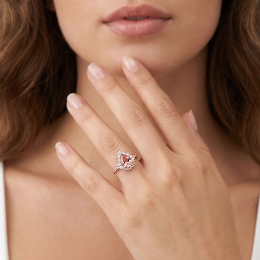 Aurora’s Promise |  Pear Cut Pink Sapphire Halo Engagement Ring.