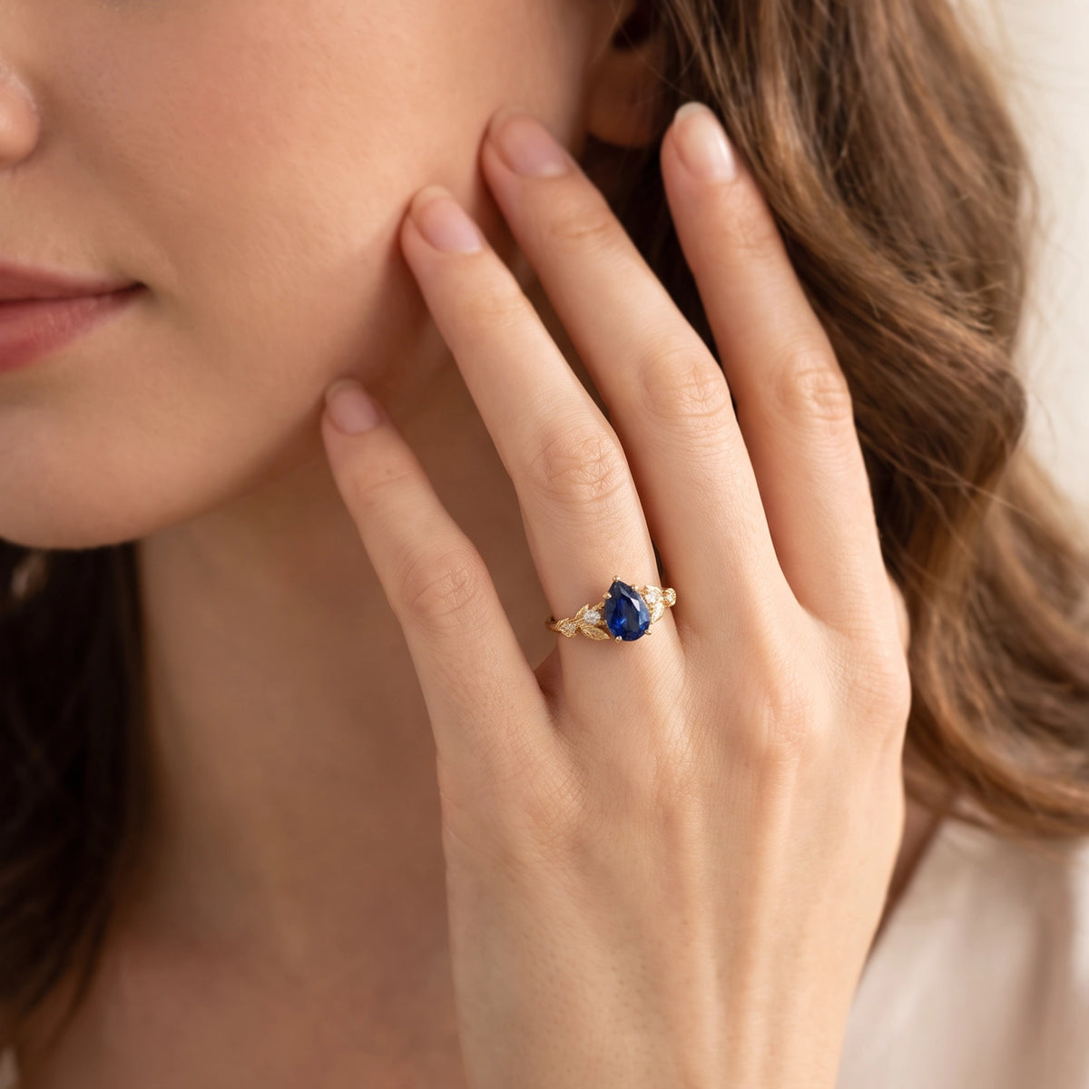 Daisy’s Twilight | 1.5CT Pear Cut Blue Sapphire Engagement Ring
