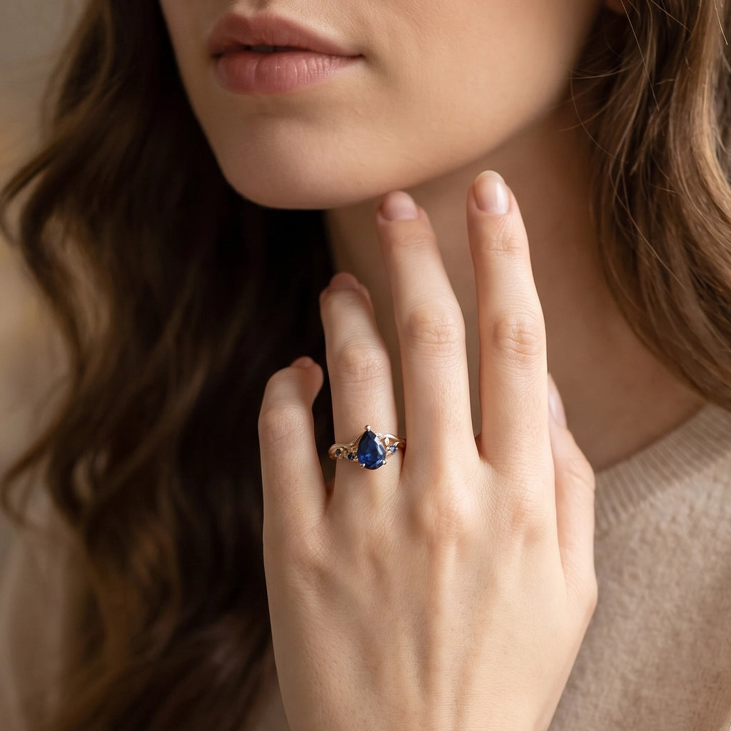 Athena’s Royalty | 1CT Pear Cut Royal Blue Sapphire Engagement Ring.