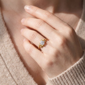 Daphne’s Dawn | Round Fantasy-Cut White Sapphire Foliage Engagement Ring