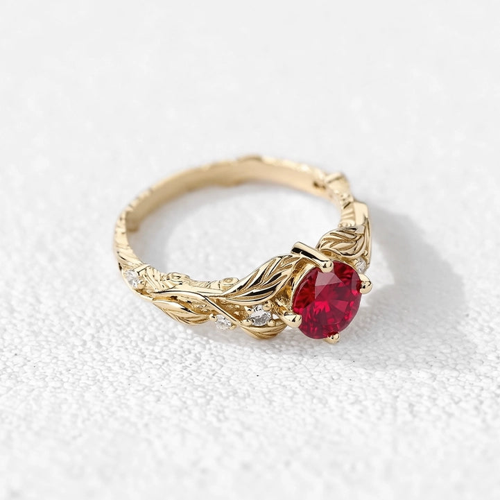 Rosalind’s Olive | Round Ruby Solitaire Ring with Olive Leaf Diamond Accents.