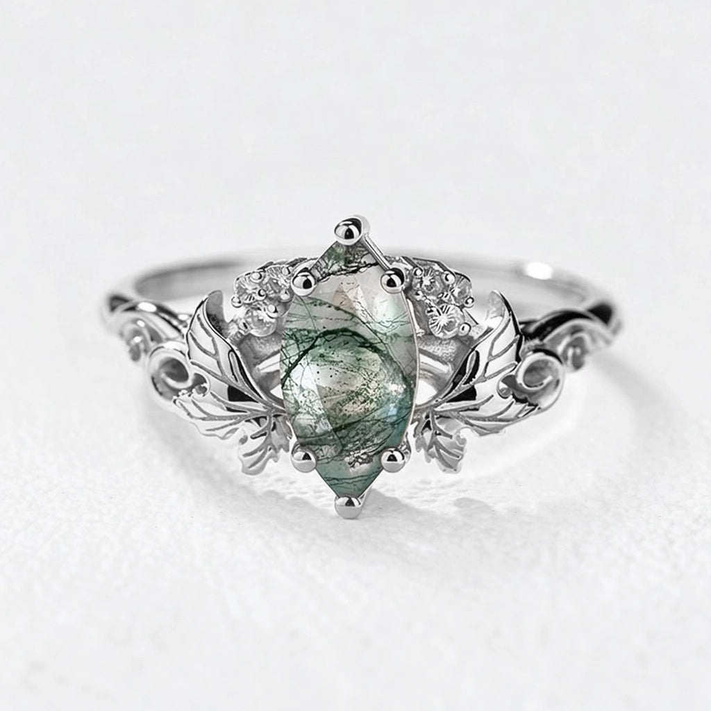 Flora’s Laurel | Marquise Cut Moss Agate Engagement Ring with Diamond Leaves.