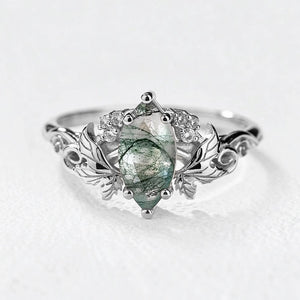 Flora’s Laurel | Marquise Cut Moss Agate Engagement Ring with Diamond Leaves.