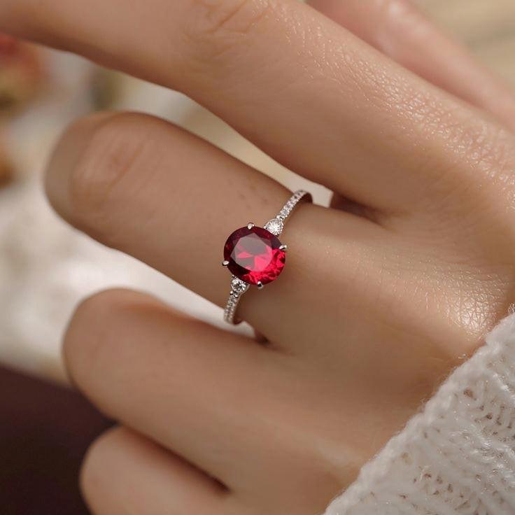 Iris’s Blaze | 2CT Oval-Cut Red Gemstone Ring.