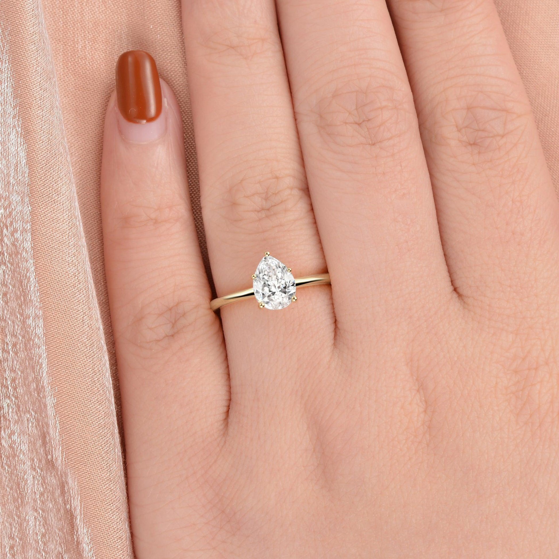1.0ct Pear Shaped Moissanite Classic Solitaire Ring.