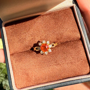 Ivy’s Corolla | Round Orange Garnet Engagement Ring with Petal Halo