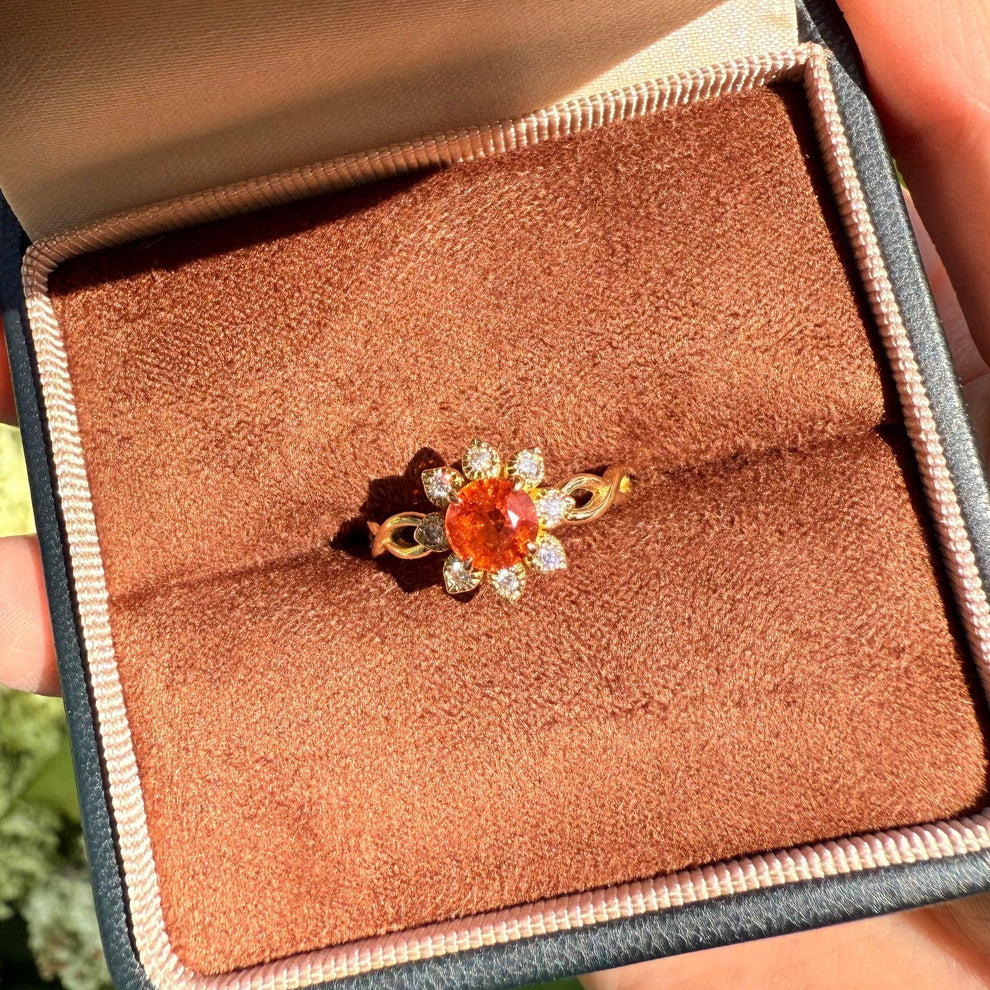 Ivy’s Corolla | Round Orange Garnet Engagement Ring with Petal Halo.