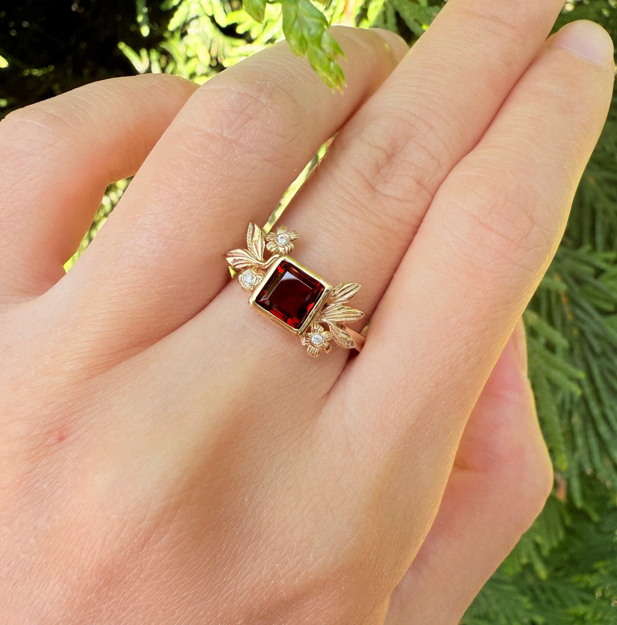 Juliet’s Crimson | Classic Princess Cut Red Ruby Leafy Halo Engagement Ring.