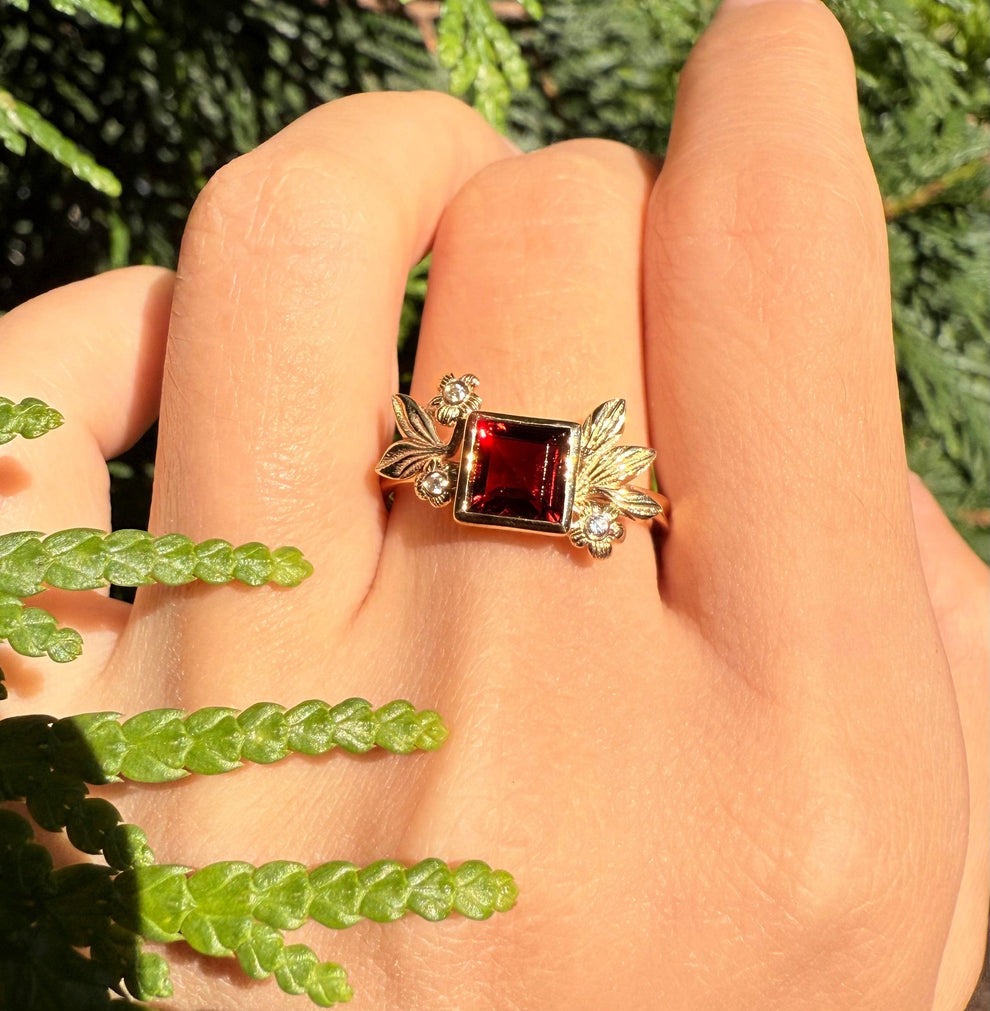 Juliet’s Crimson | Classic Princess Cut Red Ruby Leafy Halo Engagement Ring.