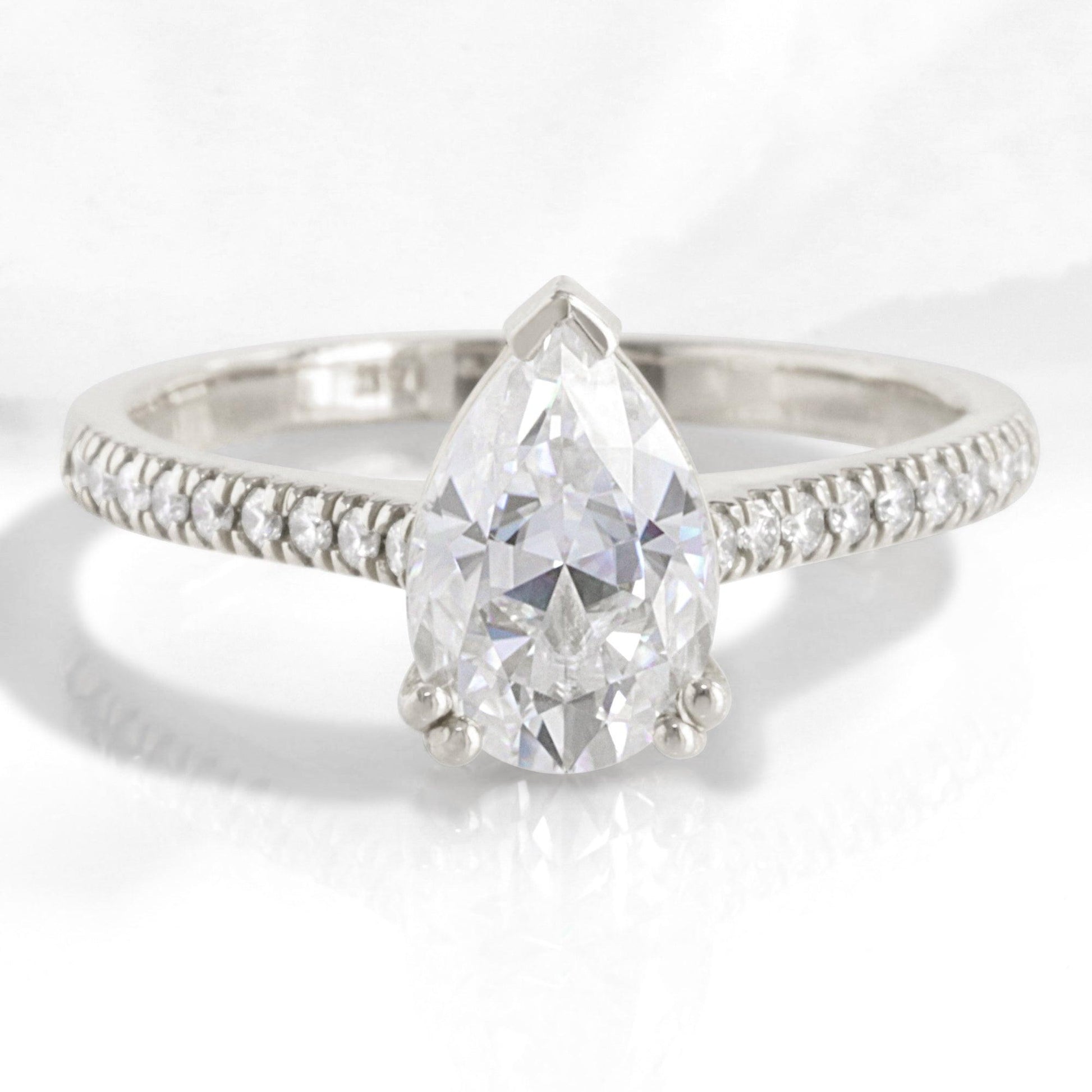 Pear Moissanite Engagement Ring in Grace Solitaire Pave Diamond Band.