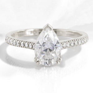 Pear Moissanite Engagement Ring in Grace Solitaire Pave Diamond Band.