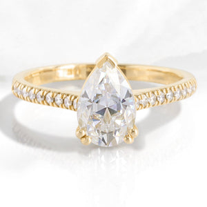 Pear Moissanite Engagement Ring in Grace Solitaire Pave Diamond Band.