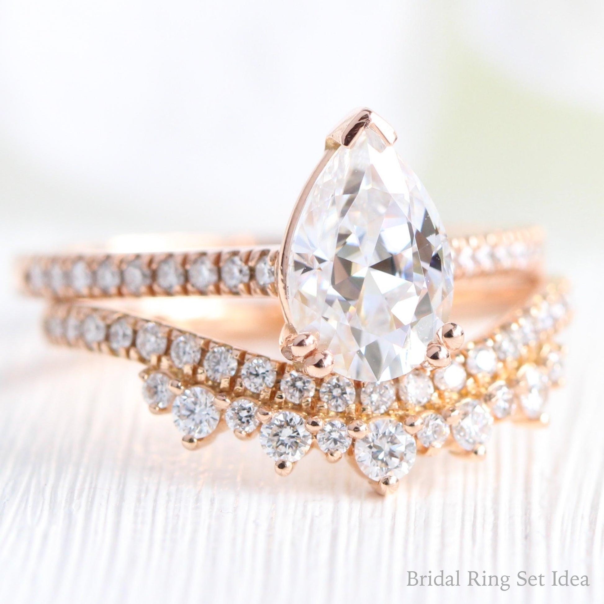 Pear Moissanite Engagement Ring in Grace Solitaire Pave Diamond Band.