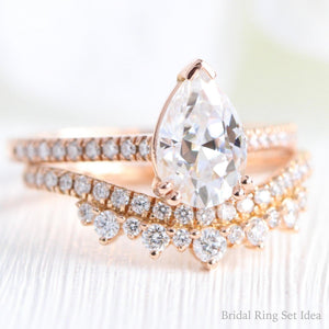 Pear Moissanite Engagement Ring in Grace Solitaire Pave Diamond Band.