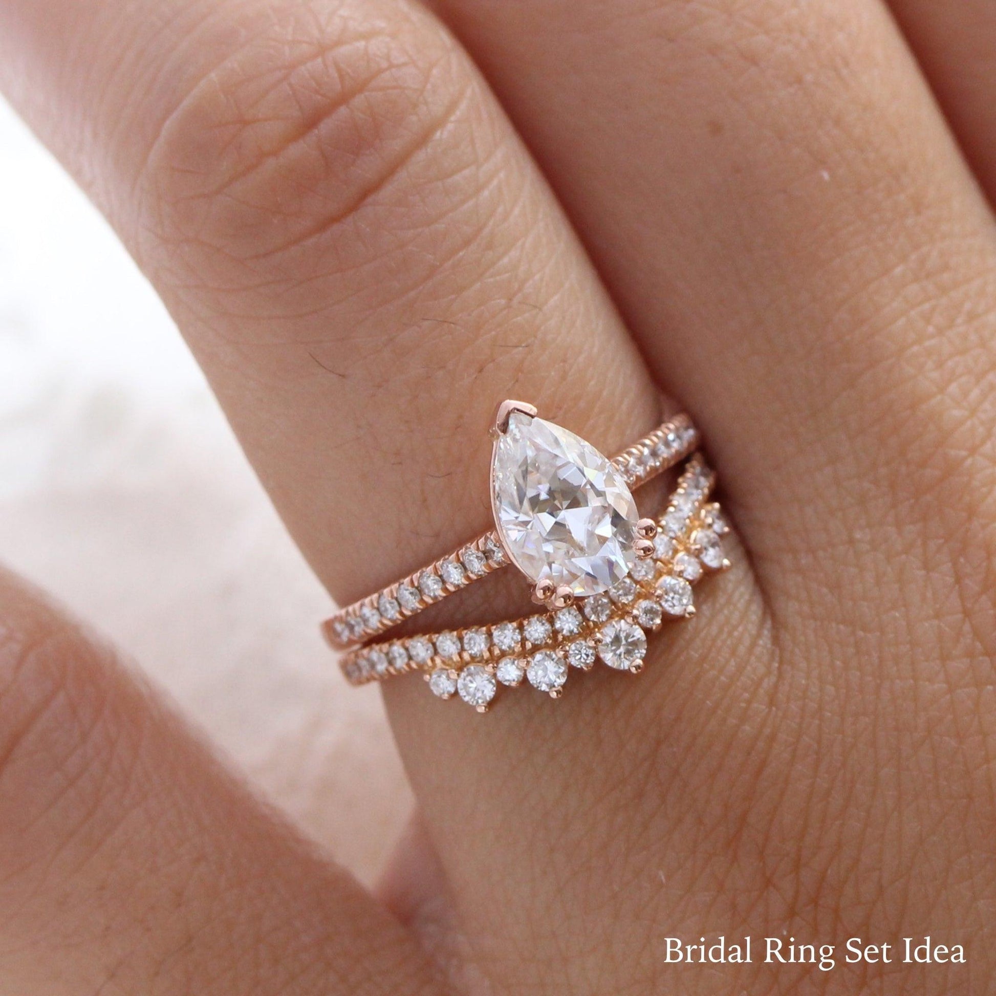 Pear Moissanite Engagement Ring in Grace Solitaire Pave Diamond Band.