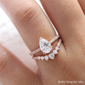 Pear Moissanite Engagement Ring in Grace Solitaire Pave Diamond Band.