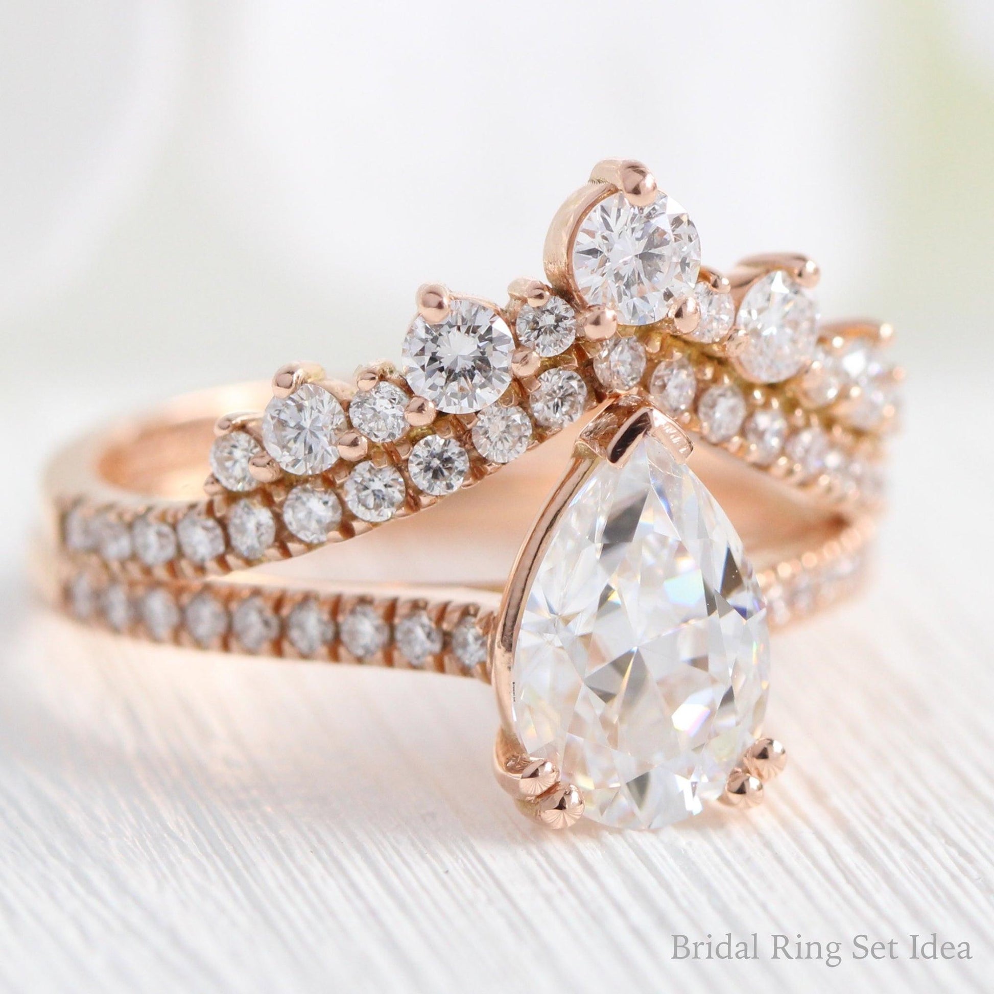 Pear Moissanite Engagement Ring in Grace Solitaire Pave Diamond Band.