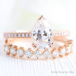 Pear Moissanite Engagement Ring in Grace Solitaire Pave Diamond Band.