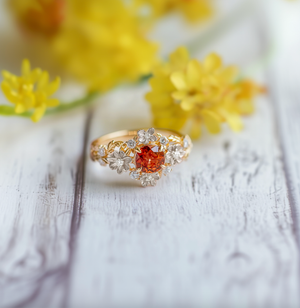 Eve's Blossom | Round Mandarin Garnet Engagement Ring with Petal Setting.