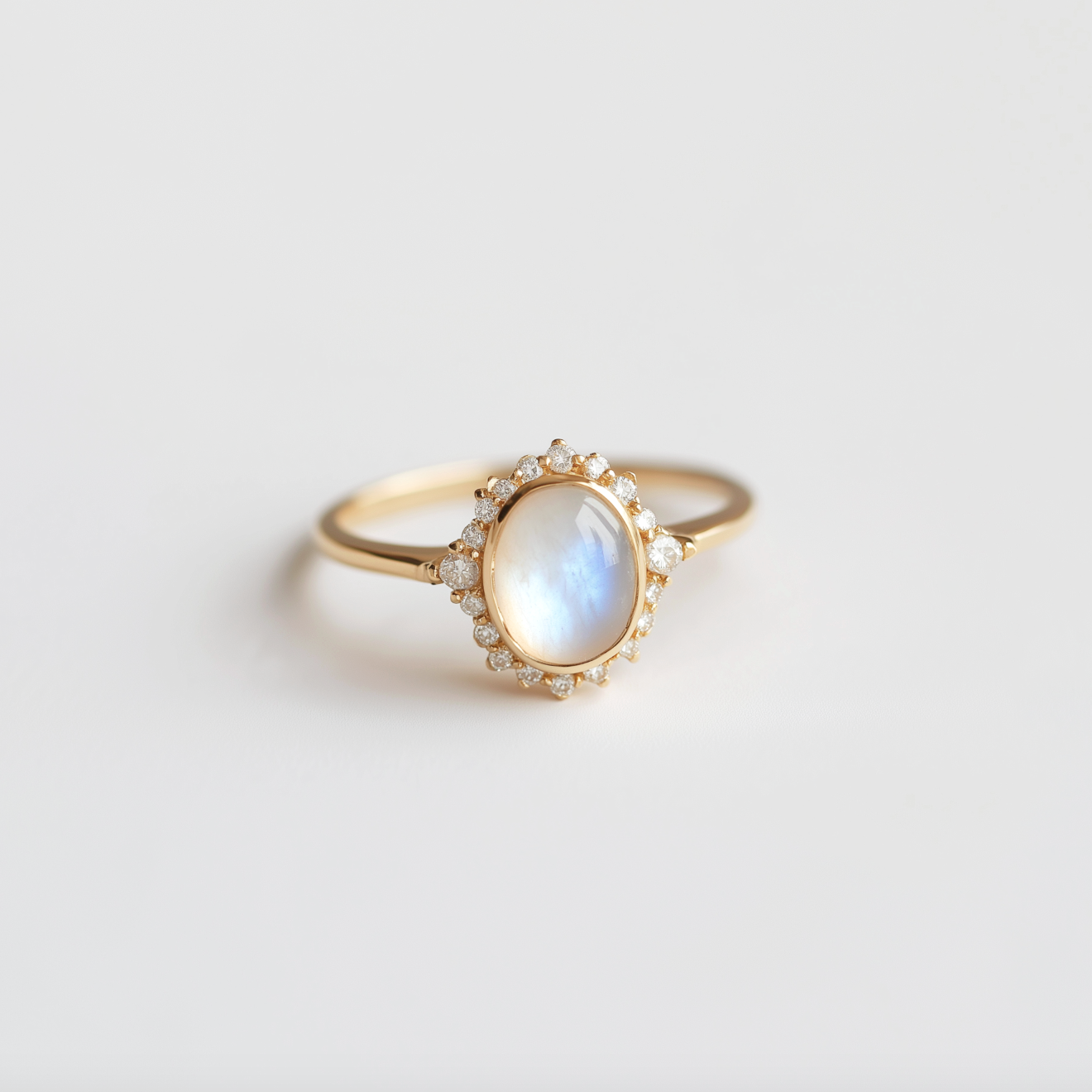 Elara’s Luster | Classic Oval Moonstone Halo Engagement Ring.