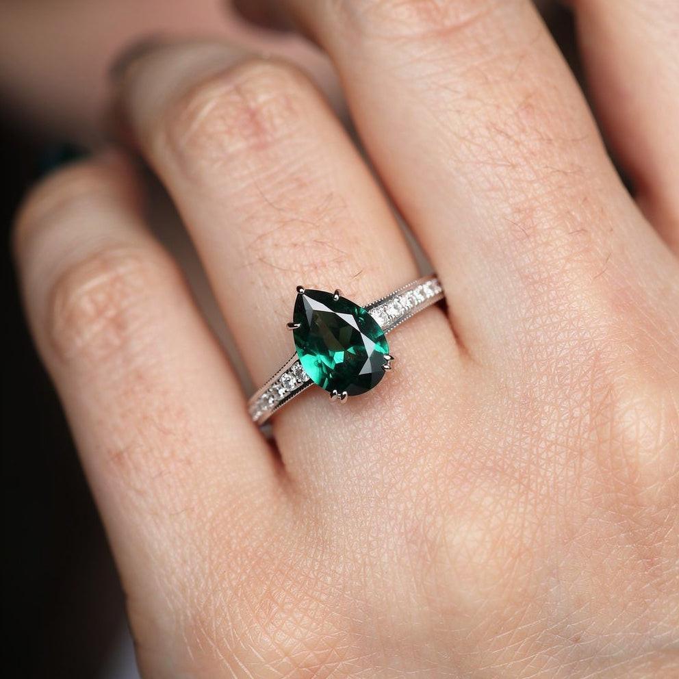 Olive’s Whisper | 1.5CT Classic Pear Cut Lab Emerald Engagement Ring.