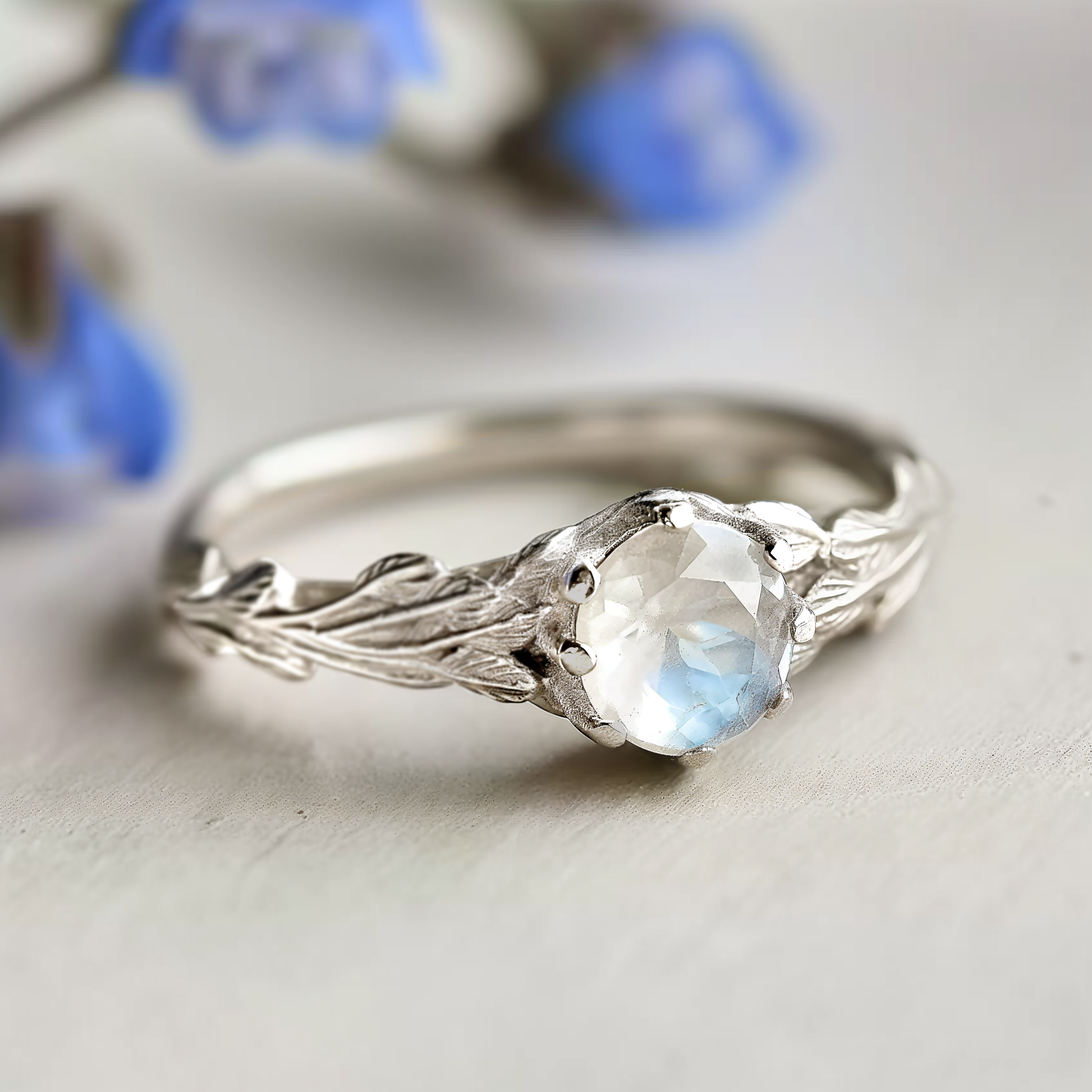 Athena’s Wings | Round Moonstone Olive Branch Engagement Ring.