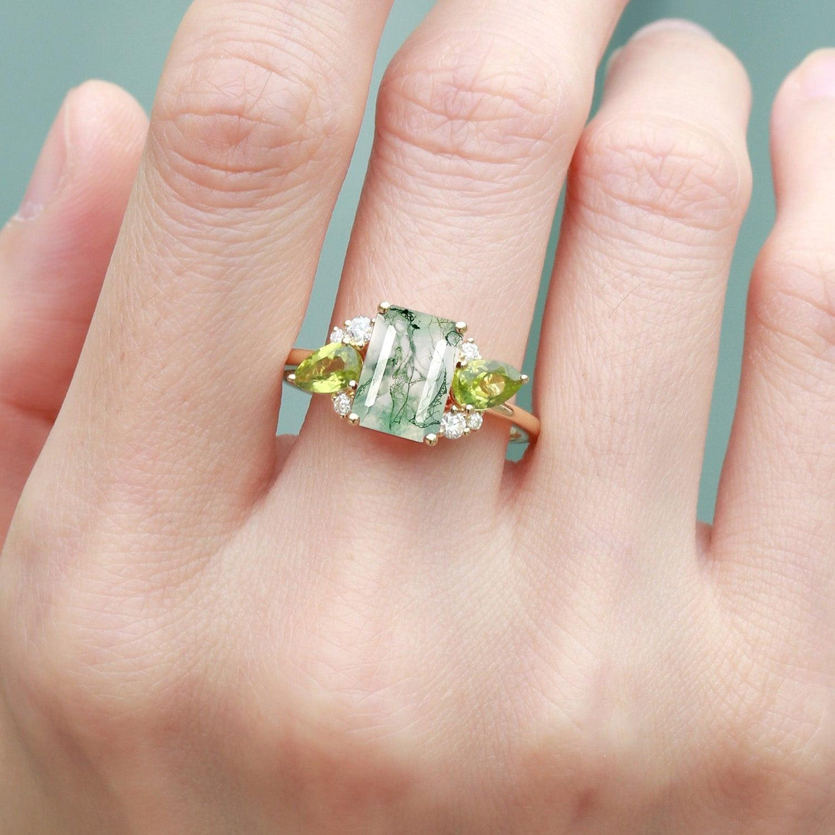 Nature Inspired Emerald Cut Moss Agate Double Pear Peridot Engagement Ring.