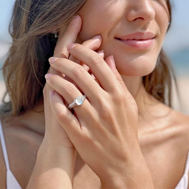 Athena’s Wings | Round Moonstone Olive Branch Engagement Ring.