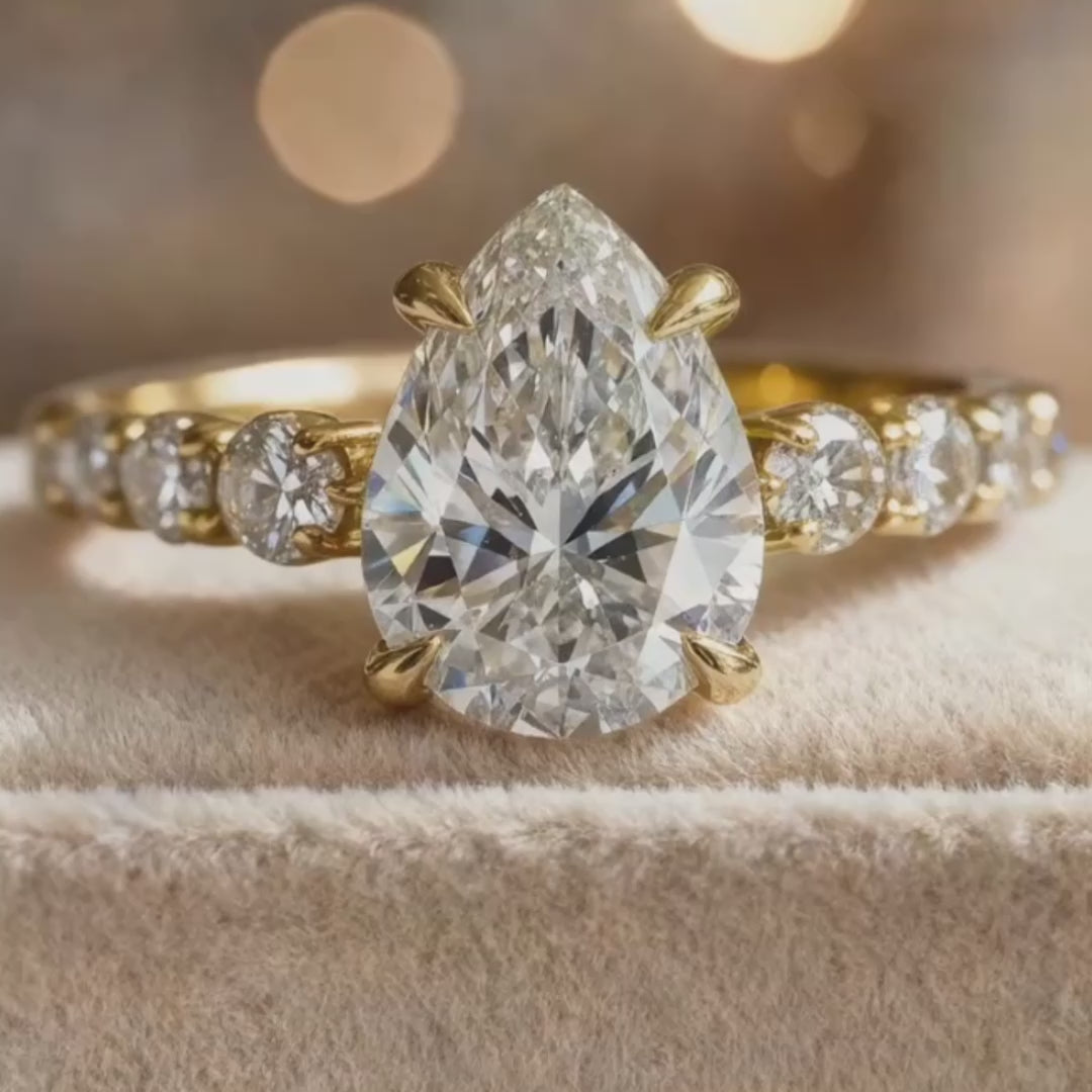Aurora‘s Whisper | 2CT Pear Cut Moissanite Eternity Ring.