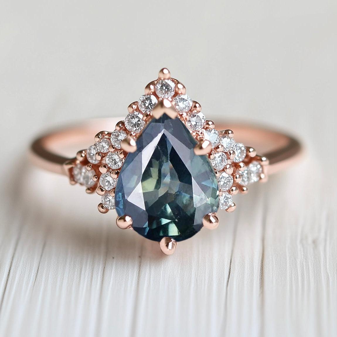 Lyra’s Twilight | Pear Blue Sapphire Partial Halo Ring.