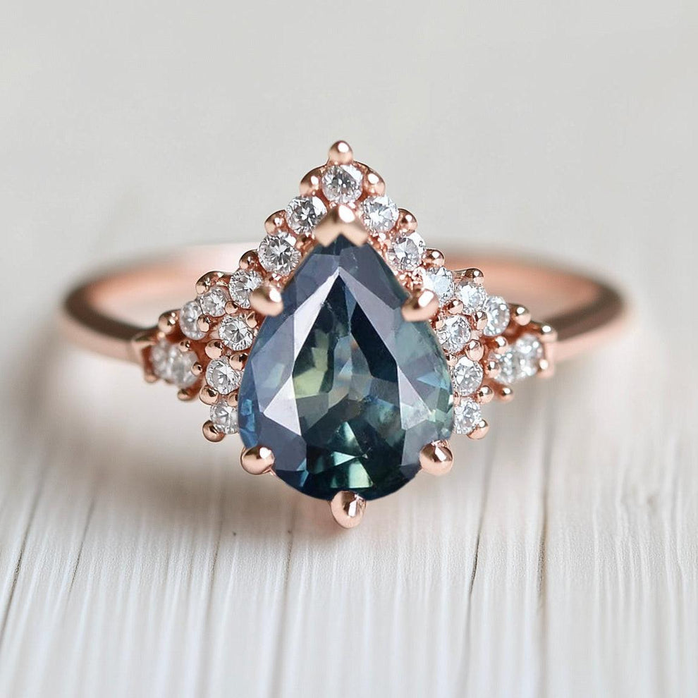 Lyra’s Twilight | Pear Blue Sapphire Partial Halo Ring.