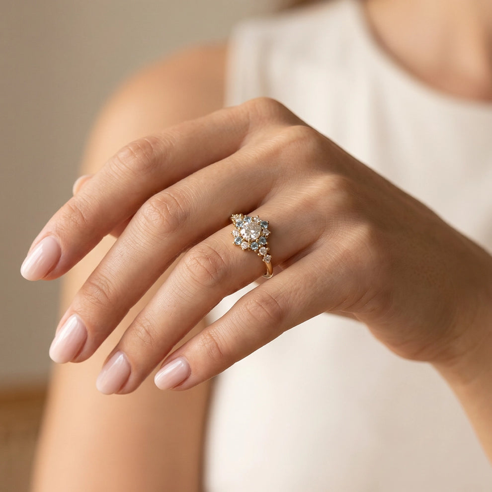 Liora's Corolla | Oval Diamond Engagement Ring with Aquamarine Petal Halo.
